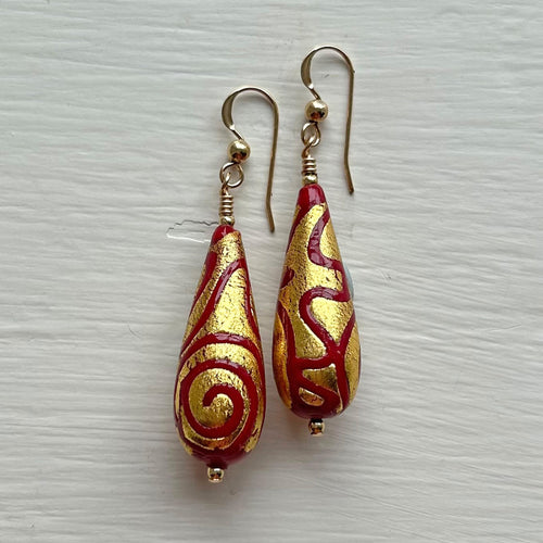 Earrings with red pastel appliqué Aztec over gold Murano glass long pear drops
