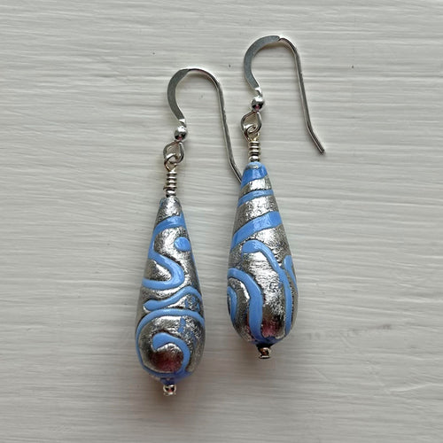 Earrings with turquoise (blue) pastel appliqué Aztec over white gold Murano glass long pear drops