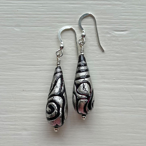 Earrings with black pastel appliqué Aztec over white gold Murano glass long pear drops