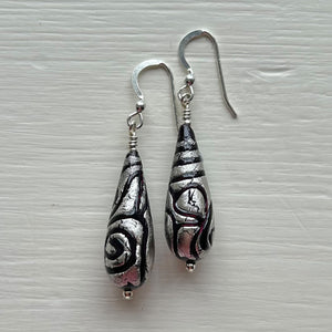 Earrings with black pastel appliqué Aztec over white gold Murano glass long pear drops
