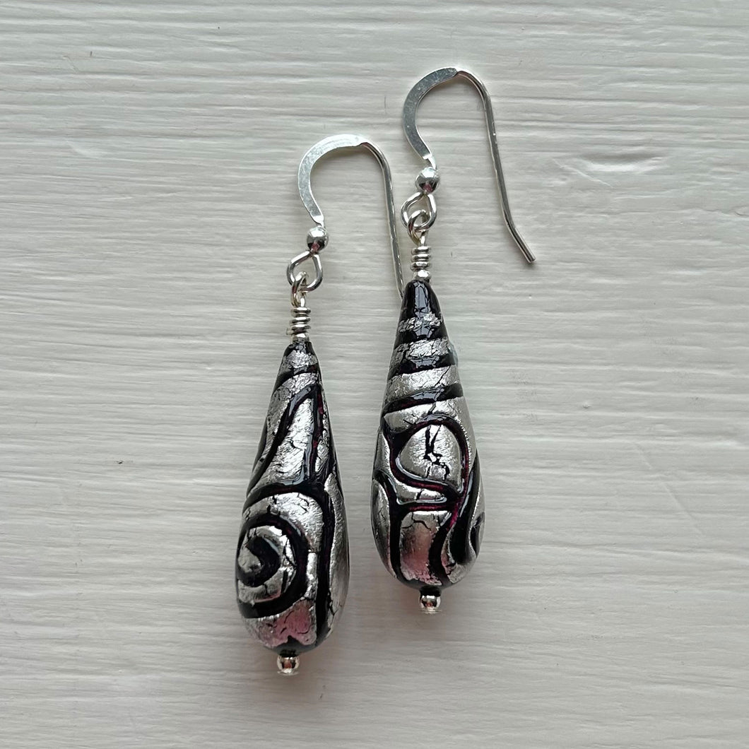 Earrings with black pastel appliqué Aztec over white gold Murano glass long pear drops