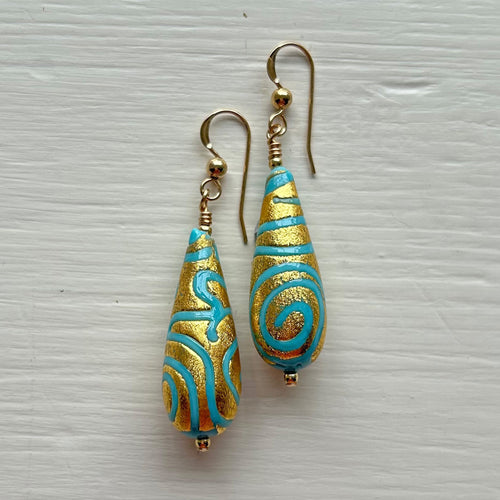 Earrings with turquoise (blue) pastel appliqué Aztec over gold Murano glass long pear drops