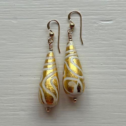 Earrings with white pastel appliqué Aztec over gold Murano glass long pear drops
