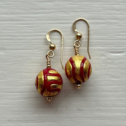 Earrings with red pastel appliqué Aztec over gold Murano glass small sphere drops
