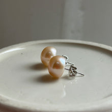 Pearl earrings with large pink cultured freshwater near round studs on surgical steel posts