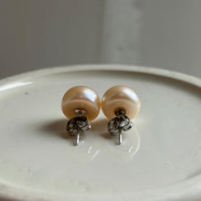 Pearl earrings with large pink cultured freshwater near round studs on surgical steel posts