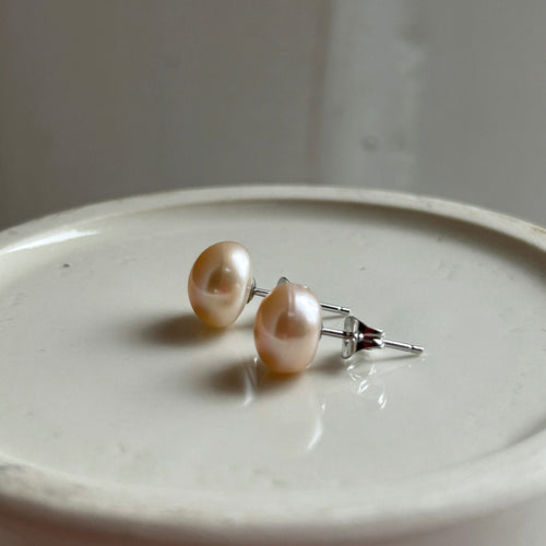 Pearl earrings with medium pink cultured freshwater near round studs on surgical steel posts