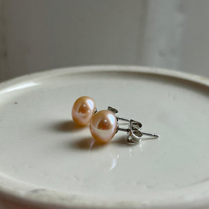 Pearl earrings with small pink cultured freshwater near round studs on surgical steel posts