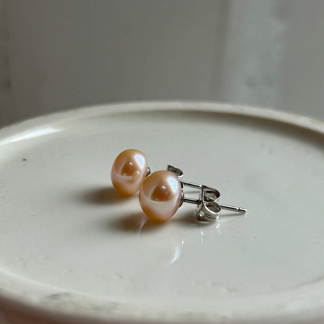 Pearl earrings with small pink cultured freshwater near round studs on surgical steel posts