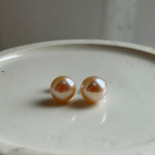 Pearl earrings with small pink cultured freshwater near round studs on surgical steel posts