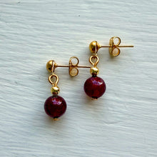 Earrings with red Murano glass sphere stud drops on gold plated posts