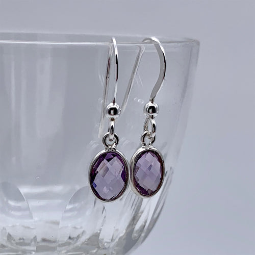 Gemstone earrings with amethyst (purple) crystal drops on silver hooks