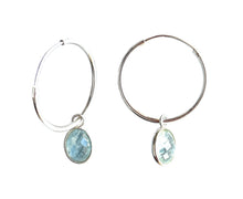 Gemstone earrings with aquamarine (blue) oval crystal drops on silver medium hoops