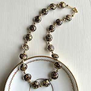 Necklace with black pastel graffiti and gold Murano glass medium lentil beads on gold