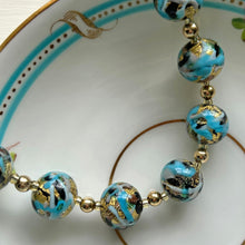 Necklace with aqua and turquoise carnival and gold Murano glass small sphere beads on gold