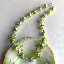 Necklace with light green appliqué over white gold Murano glass small sphere beads on silver