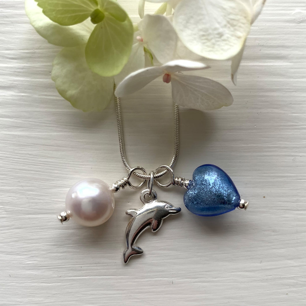 Three charm necklace in Sterling Silver with blue Murano glass heart, dolphin and pearl