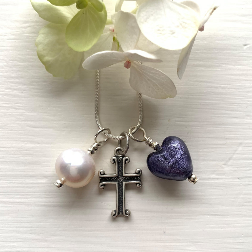Three charm necklace in Sterling Silver with purple Murano glass heart, cross and pearl