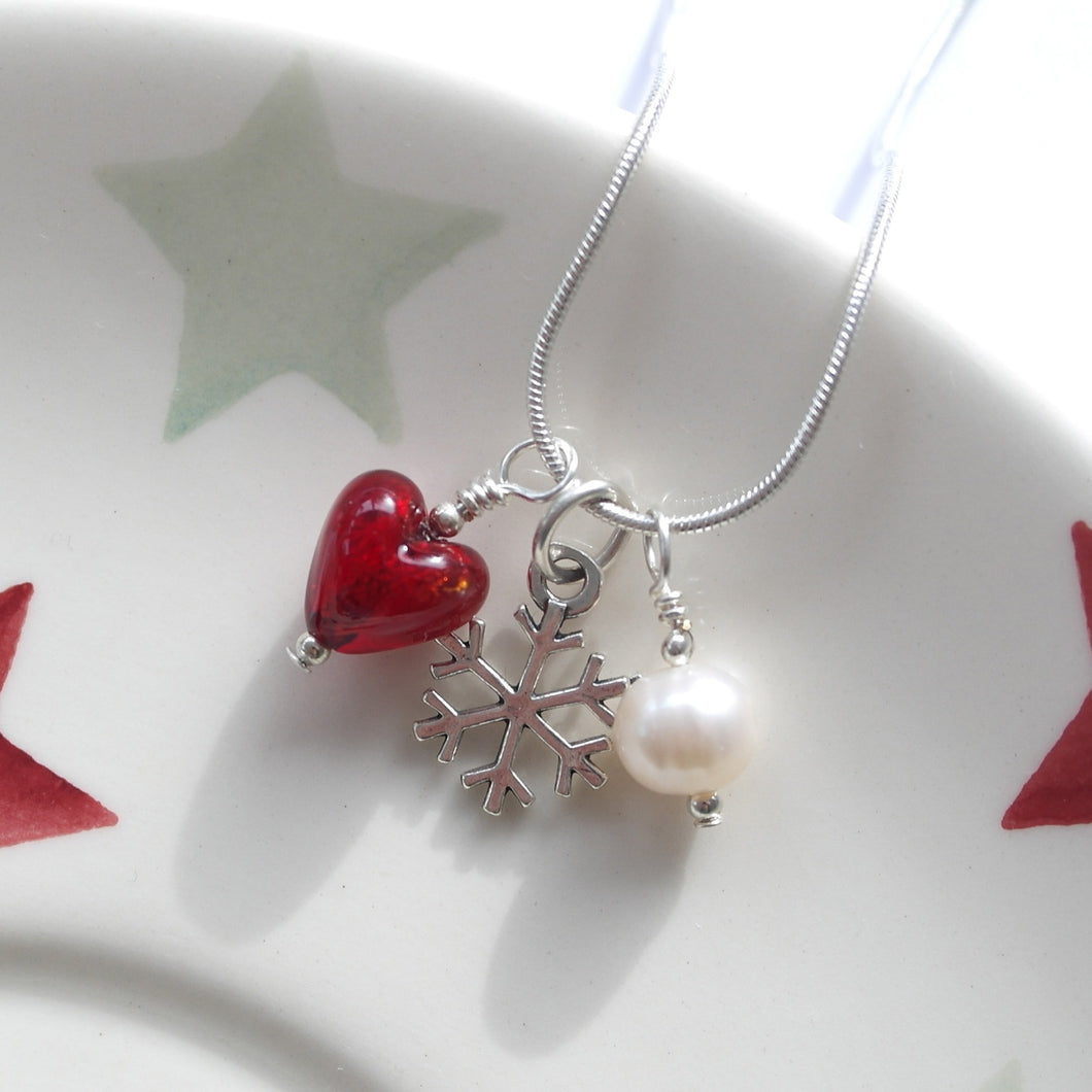 Three charm necklace in Sterling Silver with red Murano glass heart, snow flake and pearl