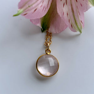 Gemstone necklace with rose quartz (pink) crystal pendant on gold cable chain
