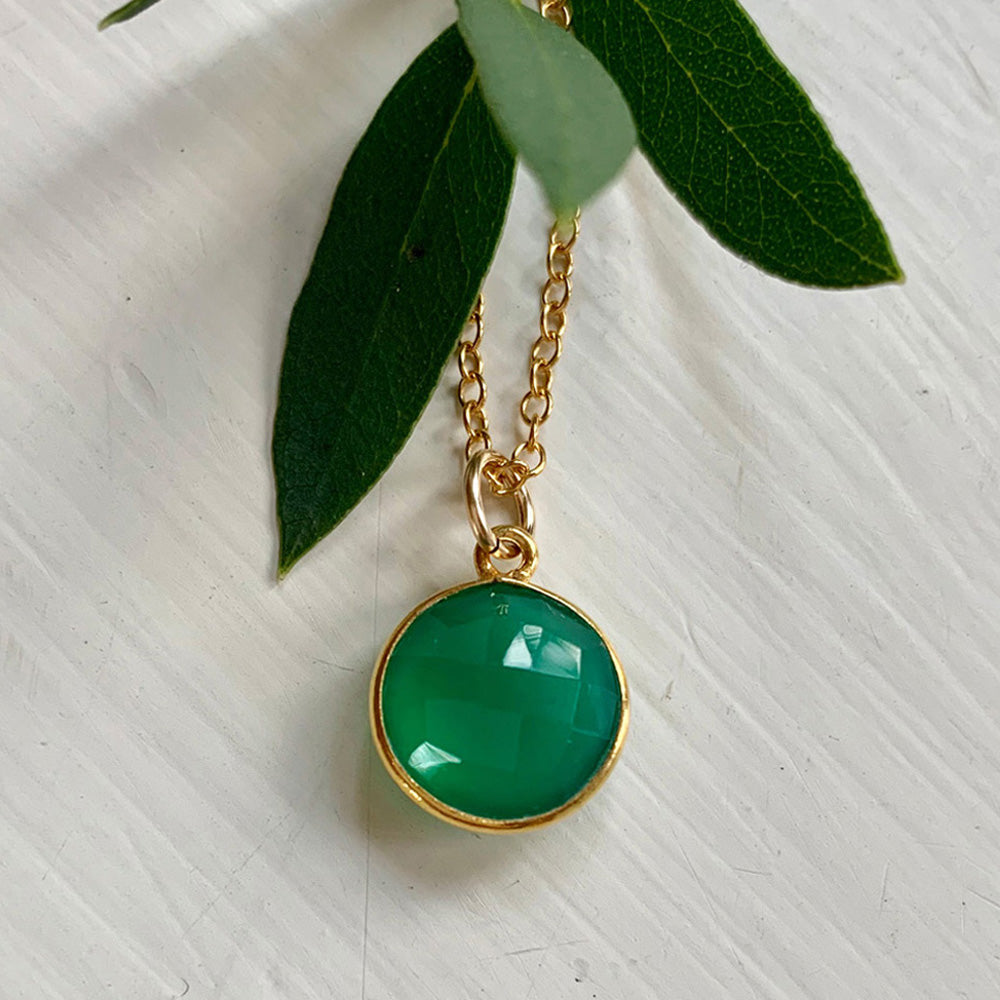 Gemstone necklace with green onyx crystal pendant on gold cable chain