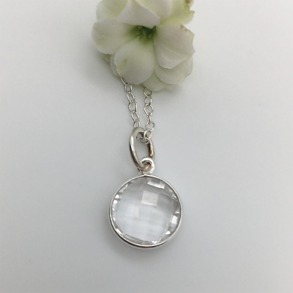 Gemstone necklace with clear quartz (rock crystal) crystal pendant on silver cable chain