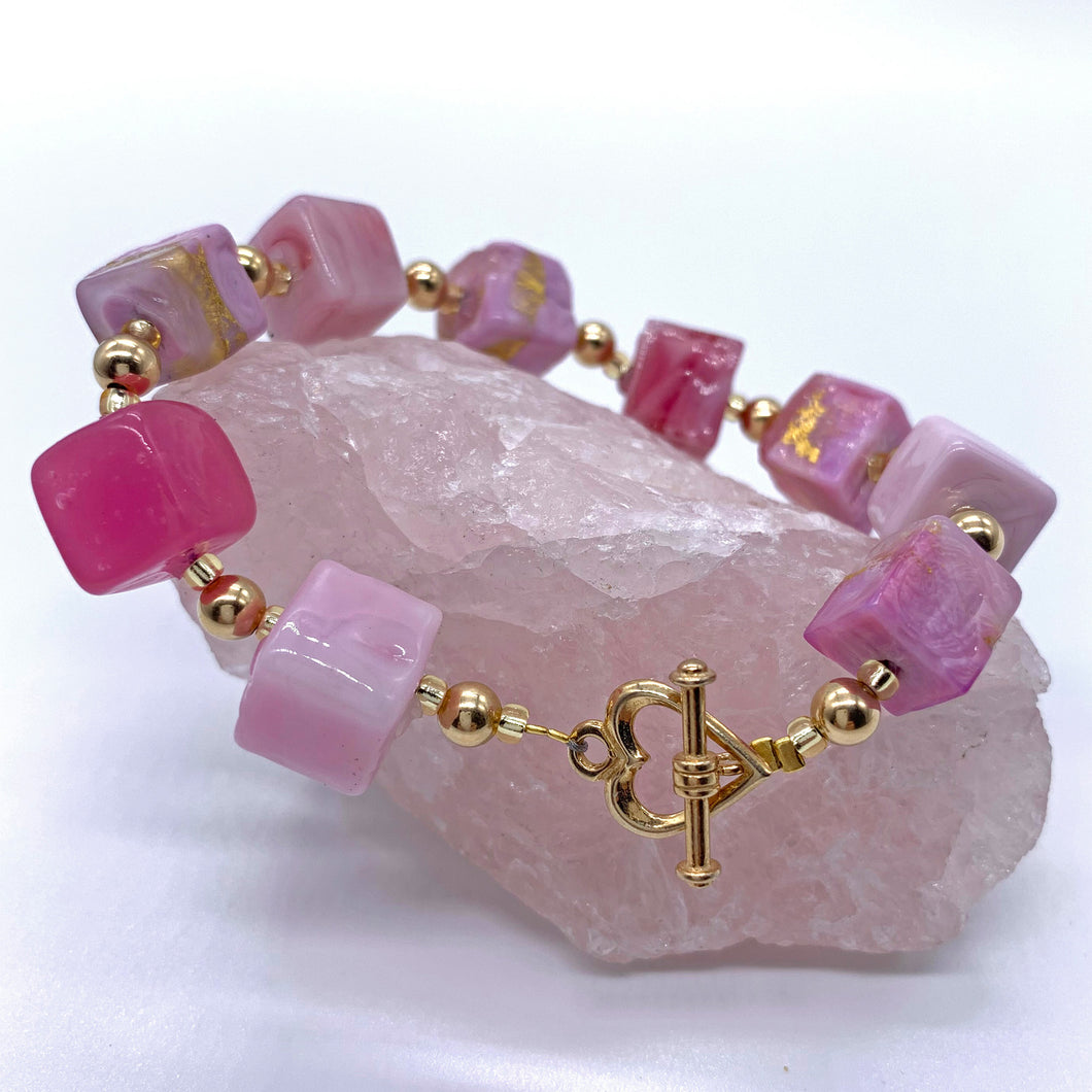 Bracelet with shades of pink and gold Murano glass cube beads on 22 Carat gold vermeil