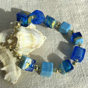 Bracelet with shades of blue and gold Murano glass cube beads on 22 Carat gold vermeil