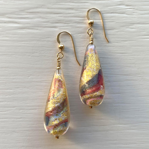 Earrings with ruby (red), periwinkle and blue swirl over gold Murano glass long pear drops