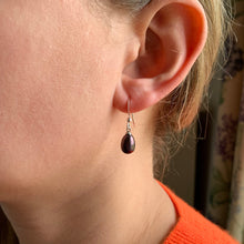 Pearl earrings with small freshwater natural black oval pearl drops on silver hooks