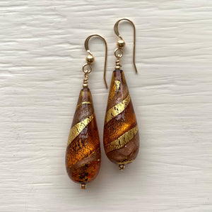 Earrings with brown topaz and aventurine swirl over gold Murano glass long pear drops