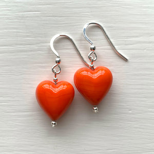Earrings with orange pastel Murano glass small heart drops on silver or gold hooks