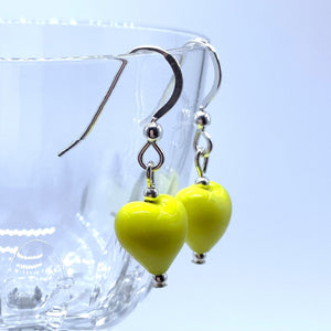 Earrings with yellow pastel Murano glass mini heart drops on silver or gold hooks