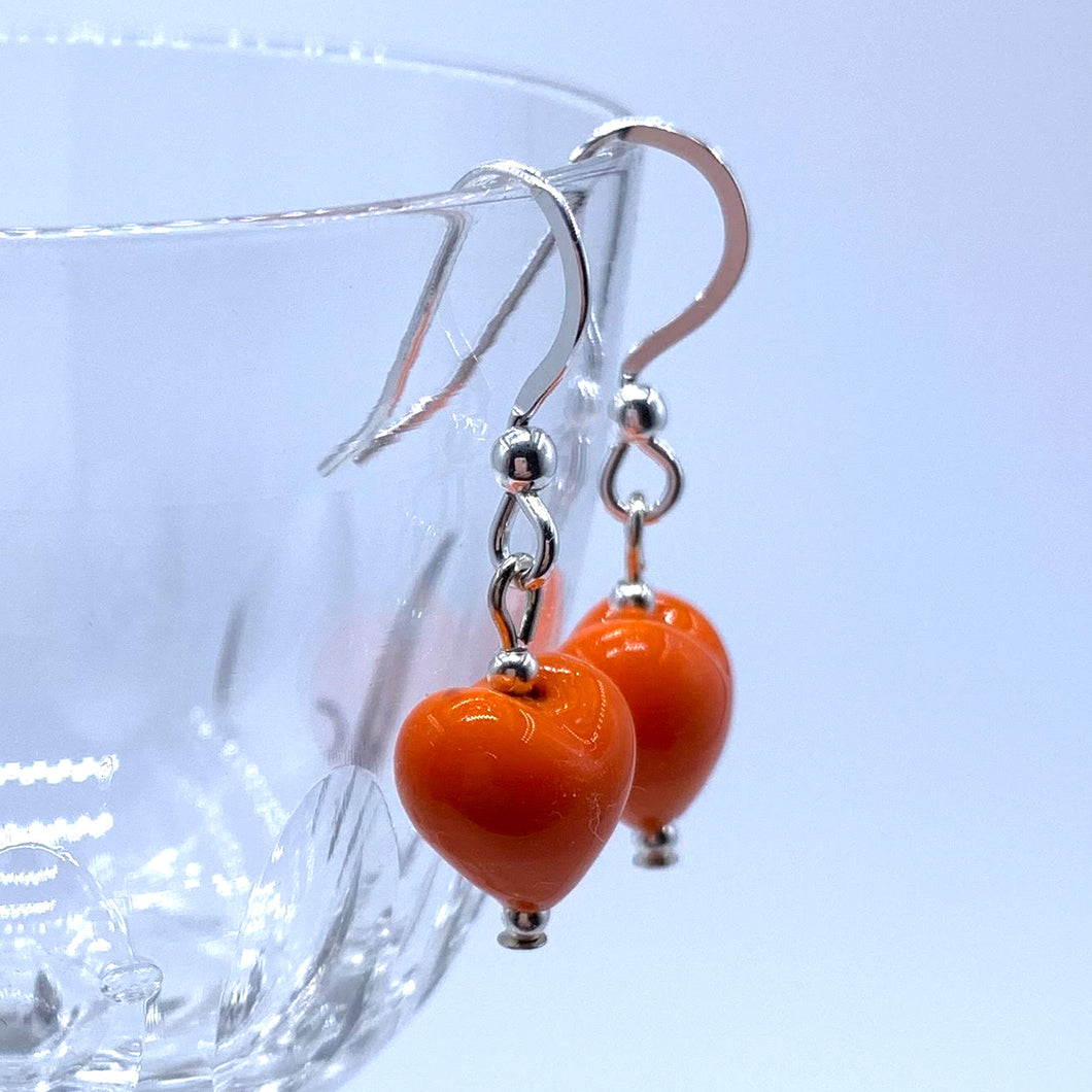 Earrings with orange pastel Murano glass mini heart drops on silver or gold hooks