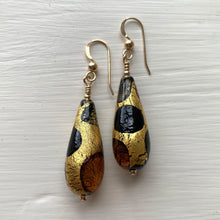 Earrings with black, grey and brown topaz spots over gold Murano glass long pear drops