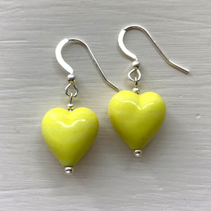 Earrings with yellow pastel Murano glass small heart drops on silver or gold hooks