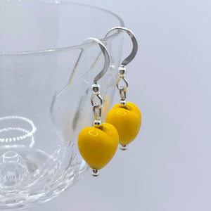 Earrings with dark yellow pastel Murano glass mini heart drops on silver or gold hooks