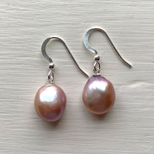 Pearl earrings with large freshwater natural purple baroque near oval pearl drops on silver hooks