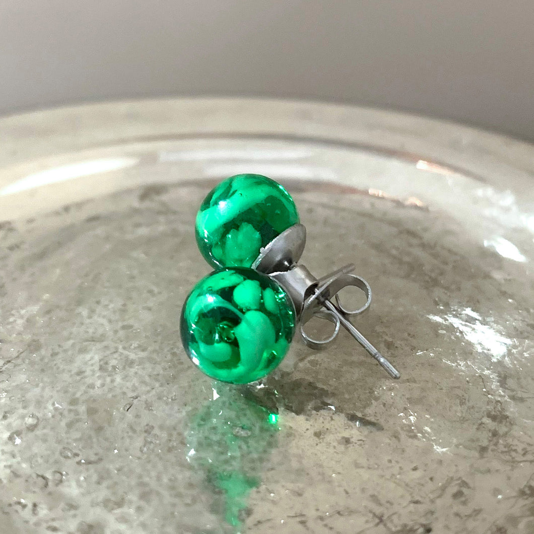 Earrings with green translucent and white flake Murano glass sphere studs on surgical steel posts