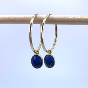Gemstone earrings with lapis lazuli (blue) oval crystal drops on gold medium hoops