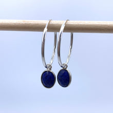 Gemstone earrings with lapis lazuli (blue) oval crystal drops on silver medium hoops