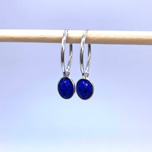 Gemstone earrings with lapis lazuli (blue) oval crystal drops on silver small hoops