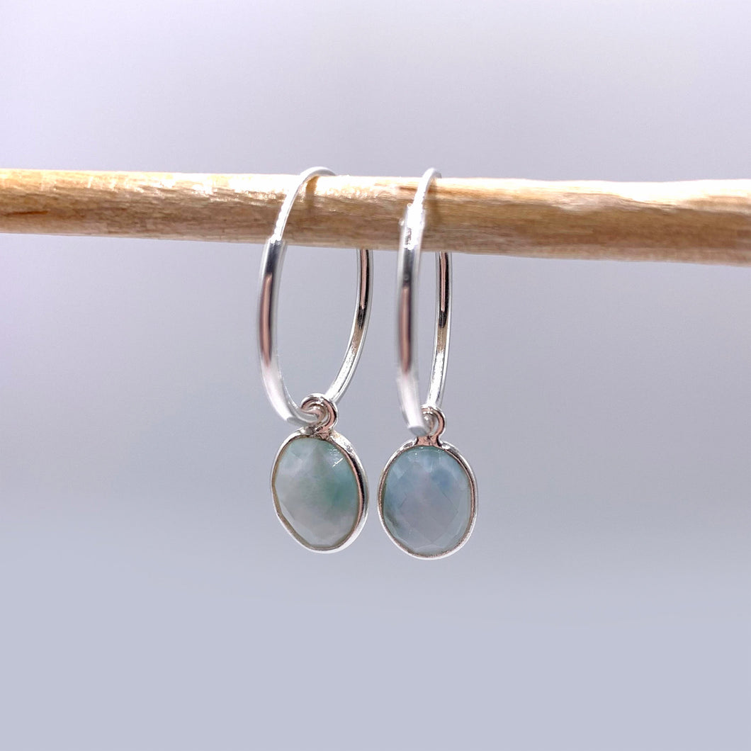 Gemstone earrings with larimar (aqua, blue) oval crystal drops on silver small hinged hoops