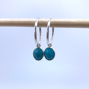 Gemstone earrings with turquoise (blue) oval crystal drops on silver small hoops
