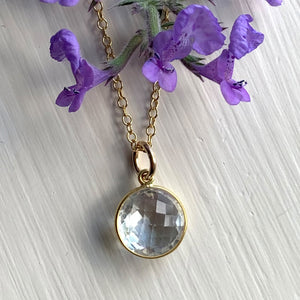 Gemstone necklace with clear quartz (rock crystal) crystal pendant on gold cable chain