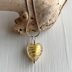 Necklace with white spiral and gold Murano glass small heart pendant on silver snake chain