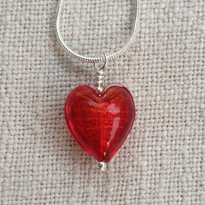 Necklace with light red Murano glass small heart pendant on silver snake chain