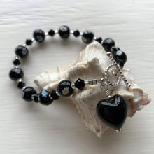 Bracelet with black Murano glass marguerite beads, Swarovski© crystals and heart charm