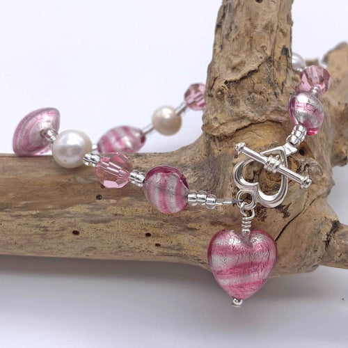 Bracelet with candy stripe pink Murano glass beads, Swarovski© crystals, pearls, charm