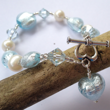 Bracelet with aquamarine (blue) Murano glass beads, Swarovski© crystals, pearls, charm